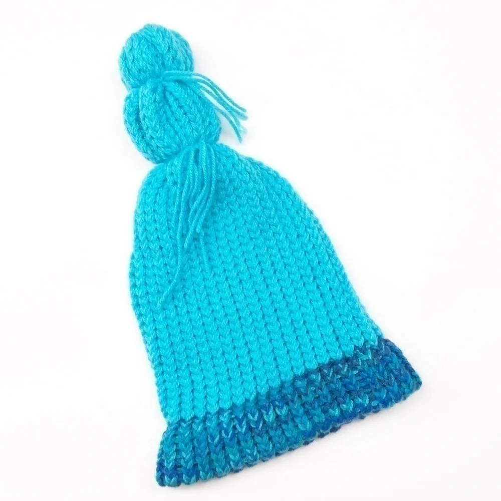 Blue pom pom crochet beanie